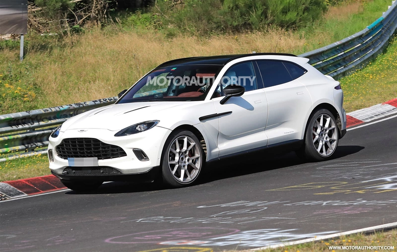 Spy shots of the 2023 Aston Martin DBX hybrid: mild hybrid first.