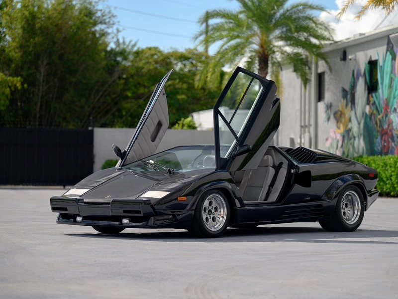 Up for auction is a Lamborghini Countach with 155 miles and original tires.