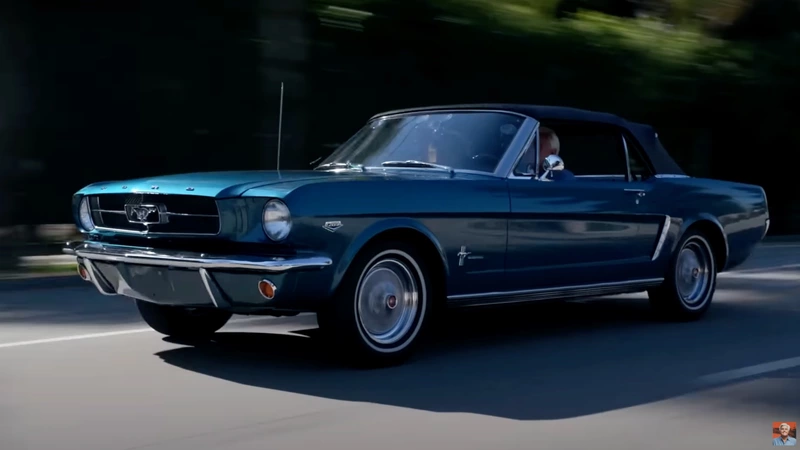 Jay Leno checks out a restored Ford Mustang K-code.